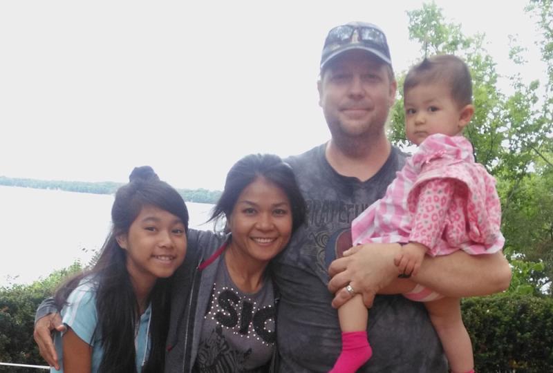 John Harryman with his wife and daughters.